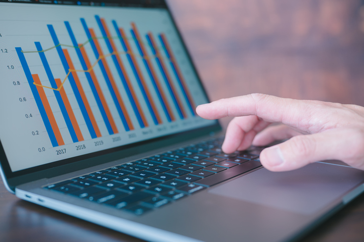 Businessman Using Computer Laptop Working With Data Charts Investment Financial Concept Finance Data Analytics Graph.Financial Management Technology.Advisor Using KPI Dashboard On Virtual Screen